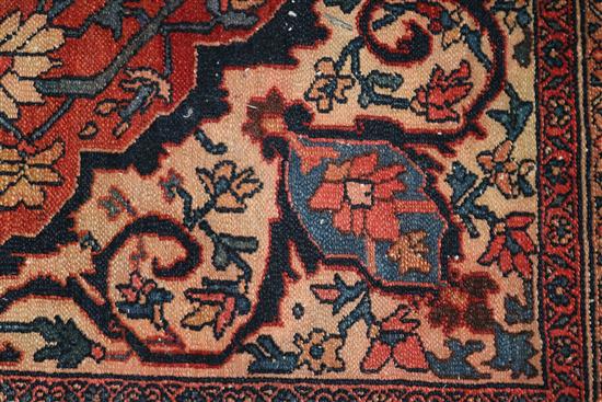 A Persian red ground rug 194 x 137cm